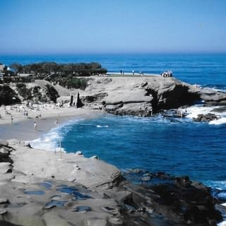 a beach with a body of water